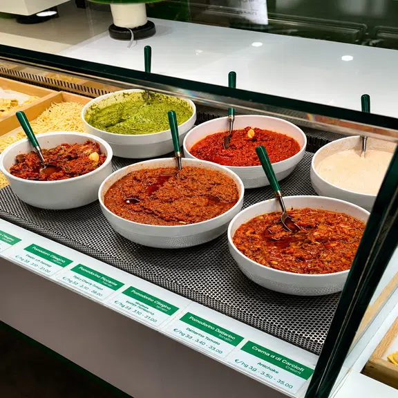 Fresh pasta selection with homemade sauces displayed at the Italian pasta bar