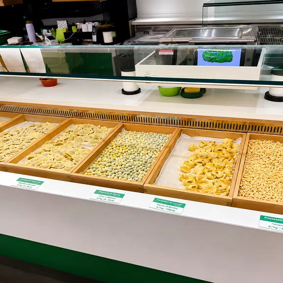 Fresh handmade Italian pasta varieties displayed at the restaurant pasta counter